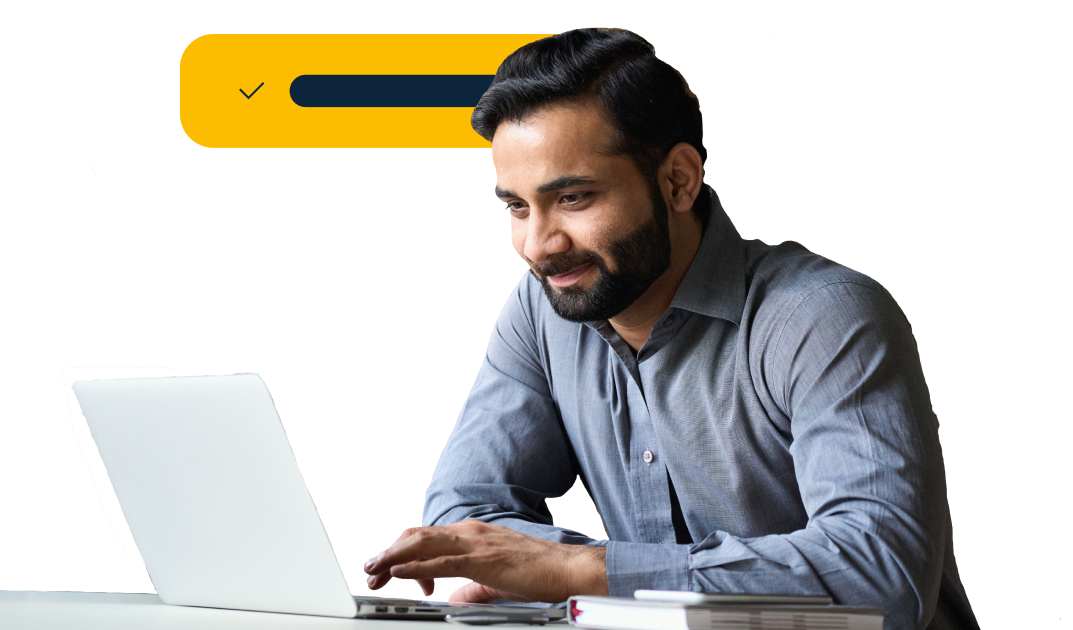 Man looking at laptop smilling